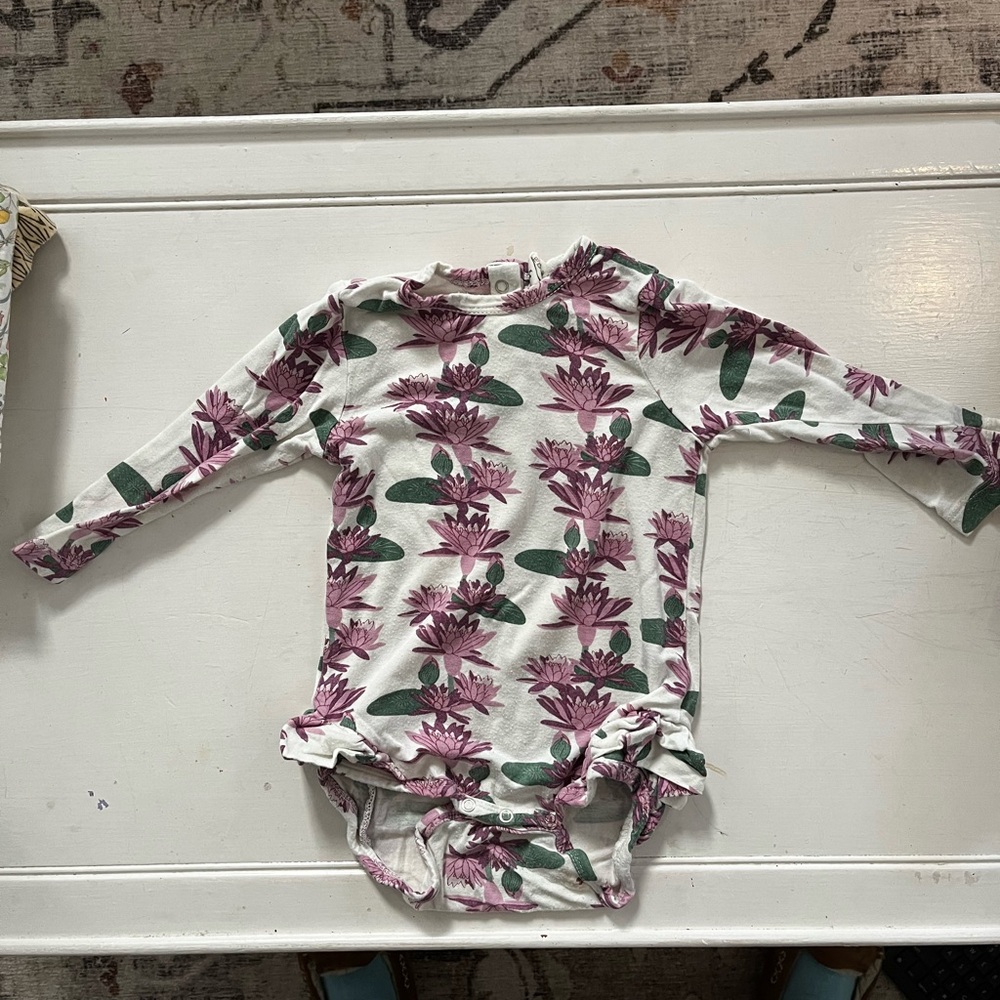 Kate Quinn onesie w ruffles at leg